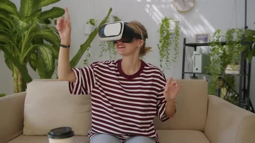 Woman Using Virtual Reality Headset on Couch