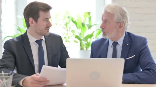 Senior Old Businessman Talking with Colleague in Office Business People