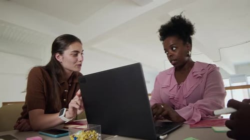 Focused Team Collaboration on Laptop Project Analysis