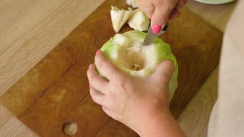 Preparing Cabbage on a Cutting Board