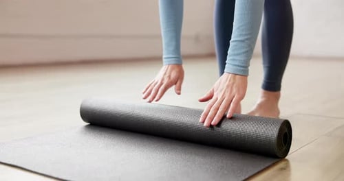 Yoga mat, rolling and woman hands in studio, meditation or balance with wellness