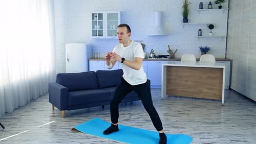 Man Doing Side Lunges Exercise at Home