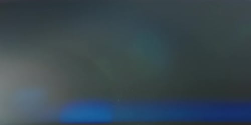 Dust Particles With Anamorphic Flare