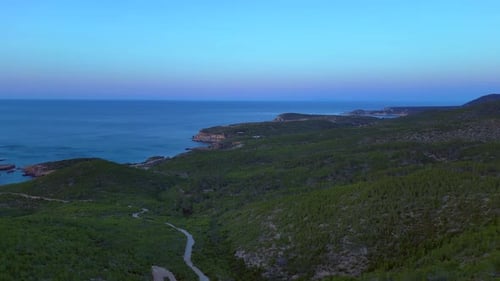 Ibiza coastline with green hills, Bays and sea. Marvelous aerial view flight drone