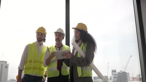 Engineers work in high rise building.