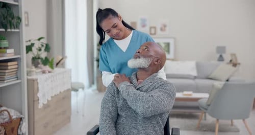 Caring Woman Helping Senior Man in Wheelchair