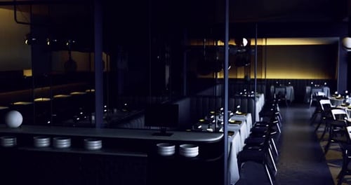 Elegant and Modern Dining Area with Dim Lighting in a Cozy Atmosphere