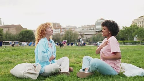 Multiethnic Friends Practicing Breathing Exercises in a Park