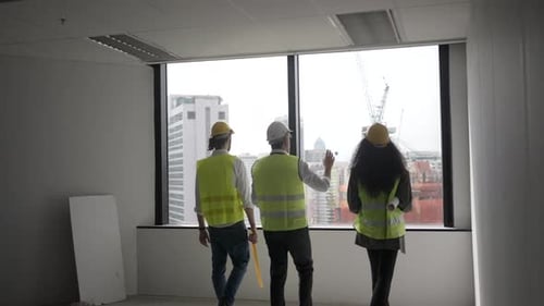 Engineers work in high rise building.