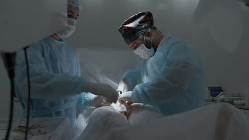 Surgeons Perform Operation in Brightly Lit Operating Room