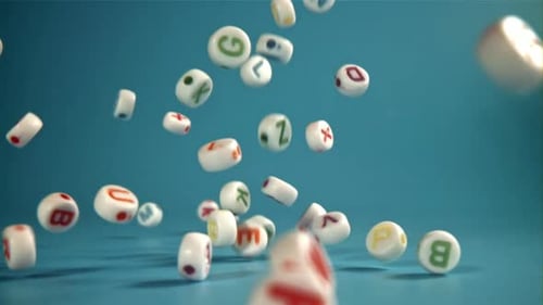 Falling Alphabet Blocks on Blue Background
