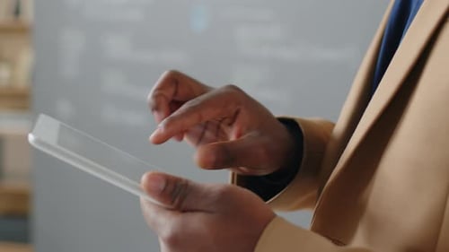 Focus on Male Hands Holding Tablet during Lecture