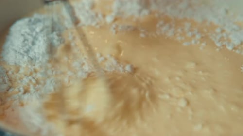 Mixing Batter and Flour with Whisk for Baking