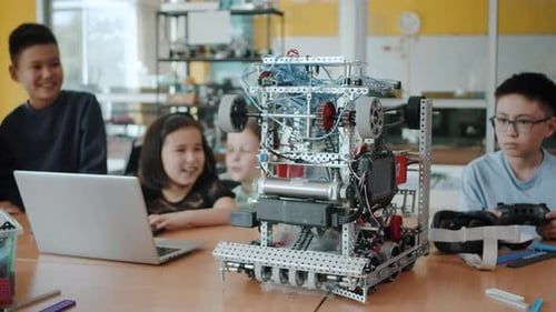 Children Coding and Assembling Robot in School Classroom