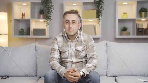 Man nodding in a positive way.