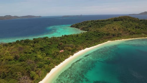 4K drone video of a beautiful tropical island paradise in Palawan, The Philippines. As the drone fli