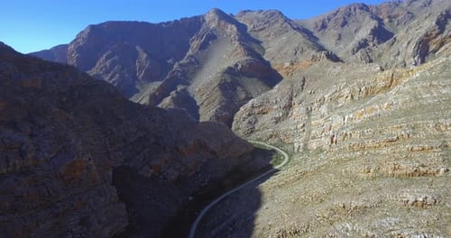 Drone, mountain and countryside for travel by road for scenery, nature or environment in aerial