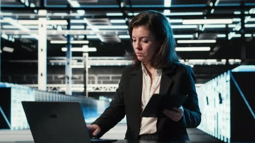 Data Center Female Admin Uses Device and AR Simulation to Conduct Security Audit