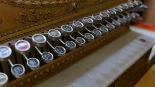 Close-up of Vintage Brass Cash Register Keys