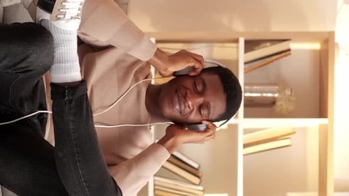 Man Enjoying Music with Headphones and Dancing