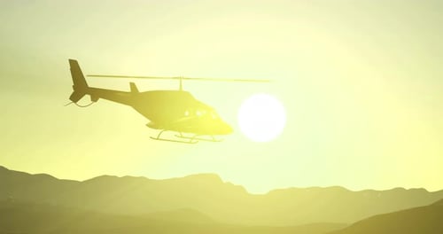 Hubschrauber fliegt bei lebendigem Sonnenuntergang mit lebendigen Farben über Hügeln