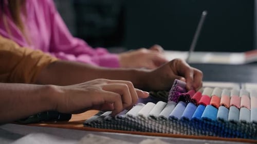 Designers Select Fabric Samples Together at a Table