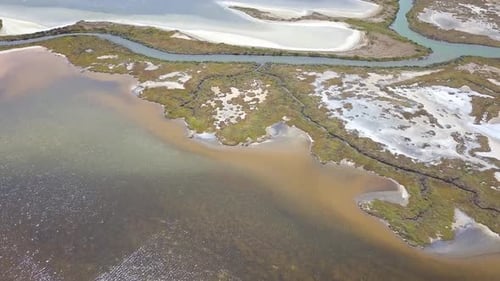 Aerial shot of marshalnds near the sea in the coast of Cadiz, Spain.