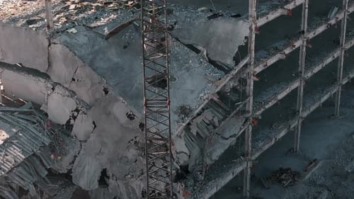 Machinery Working to Get Rid of the Rubbish in a Demolition Site Aerial Zoom Shot