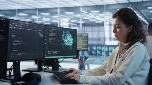 Portrait of Smiling Technician Programming in AI Data Center