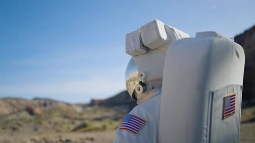 Astronaut Exploring Desert Planet in Spacesuit