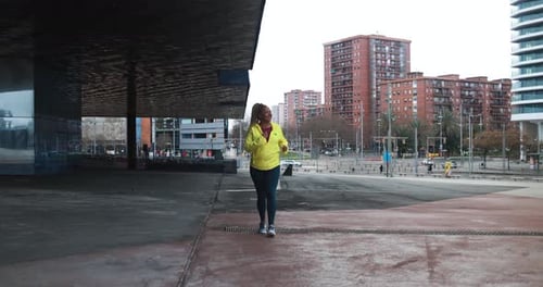 Woman Jogging in the City for Health and Fitness