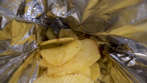 Potato chips in the package close up 4K