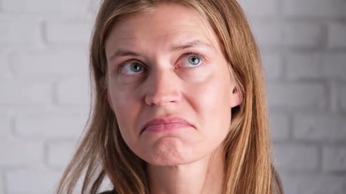 attractive young woman thinking about some ideas with delightful face