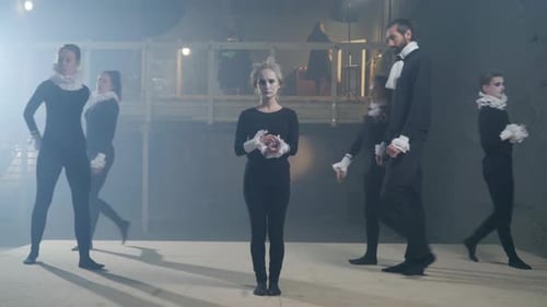 Performers in Theatrical Makeup on Stage