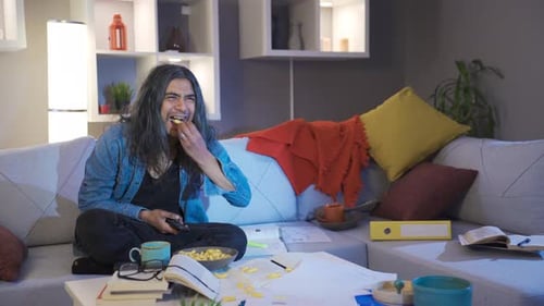 Man Laughing, Relaxing at Home With Phone