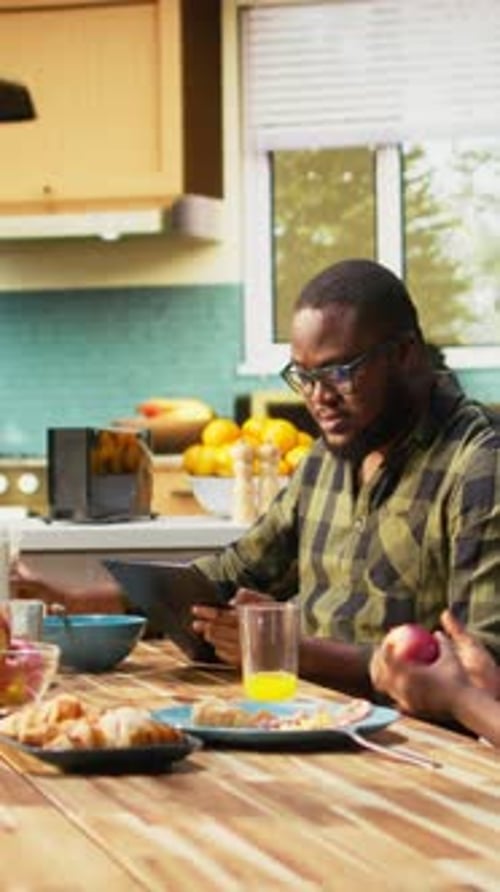 Vertical Video African American Dad Focused on Working with Tablet and Neglecting Children