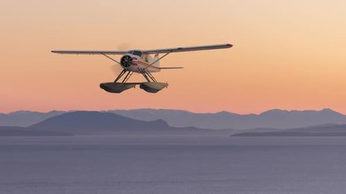 Seaplane Flying over the Pacific Ocean