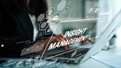 Woman Typing on Laptop with Data Overlays