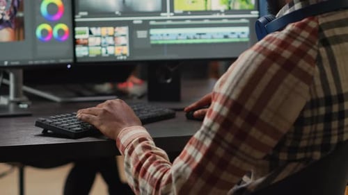 Video Editor Using Dual Monitors in an Office