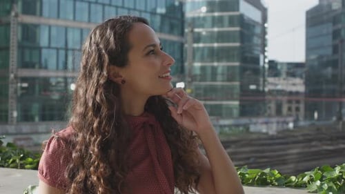 close up of doubtful woman having an idea looking away