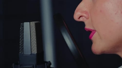 Woman Recording Podcast with Studio Microphone