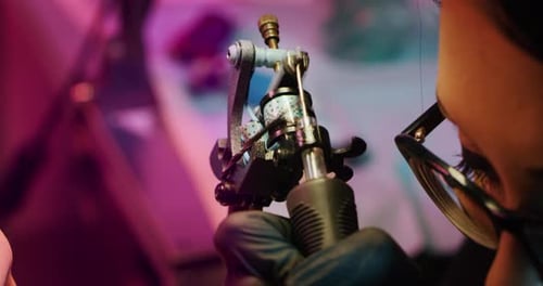 Milan/Italy-01.02.2019:Slow motion of professional female master of the art of tattooing doing a t