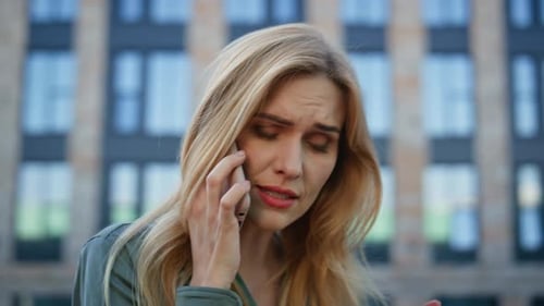 Troubled Businesswoman Calling Cellphone Expressing Dissatisfying Street Closeup