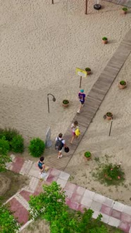Aerial View of Sandy Beach with Sunbeds and Turquoise Sea