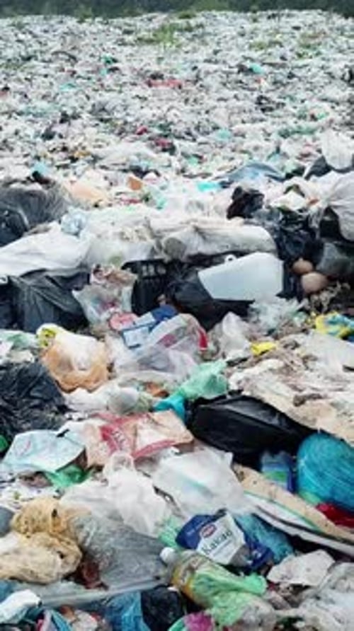 Pollution Event Plastic Waste in Electric Blue Liquid on Hill