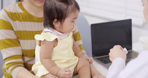 Baby Receives Vaccination at Doctor's Office