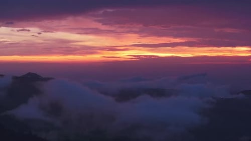 An Aerial Journey Through Colorful Sunset Clouds in Nature