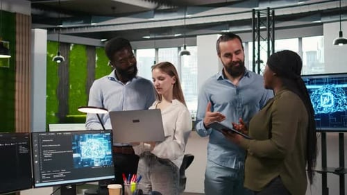 Team of Programmers in Office Automating Repetitive Tasks Using AI Scripts