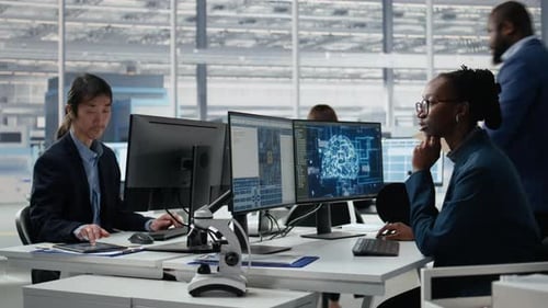 Diverse Engineers Working on High-Tech Project in Modern Industrial Office