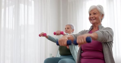 Senior Women Doing Dumbbell Exercises in Bright Room